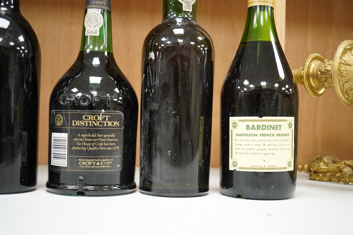 Five bottles of port and brandy, including a bottle of Dow’s 1980 bottle of port